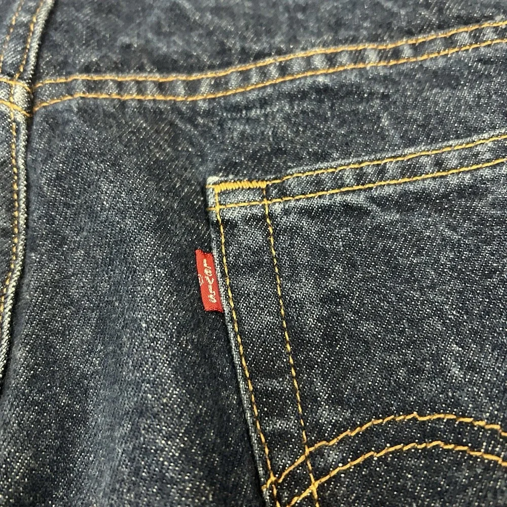 Vintage Levi's 517 Bootcut Jeans 38x27 Blue Indigo Denim Distressed Hems Mens